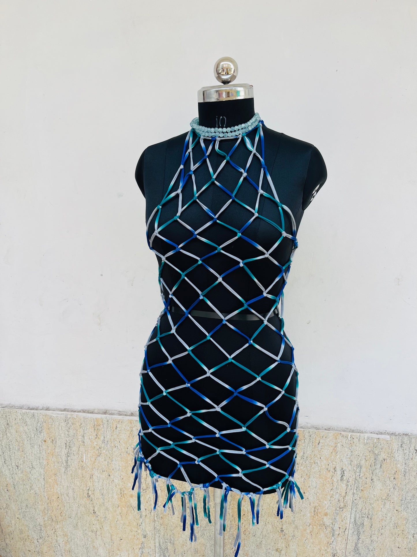 Handwoven macramé net dress in deep ocean ombré tones